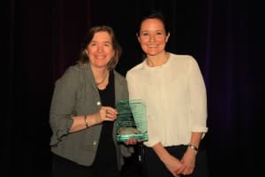 Kate Ringe-Welch of National Grid (left) accepts AESP's Outstanding Achievement in Social Media Award on behalf of the Sponsors of Mass Save from Sara Van De Grift, President of the Board, AESP, at the annual AESP National Conference in San Diego, CA. 