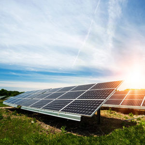 Image of solar panels in a field Clean Energy Policies and Strategies