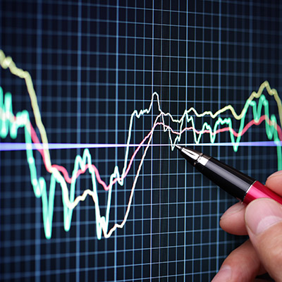 Finance image of Image of someone pointing at a graph on a screen with a pen