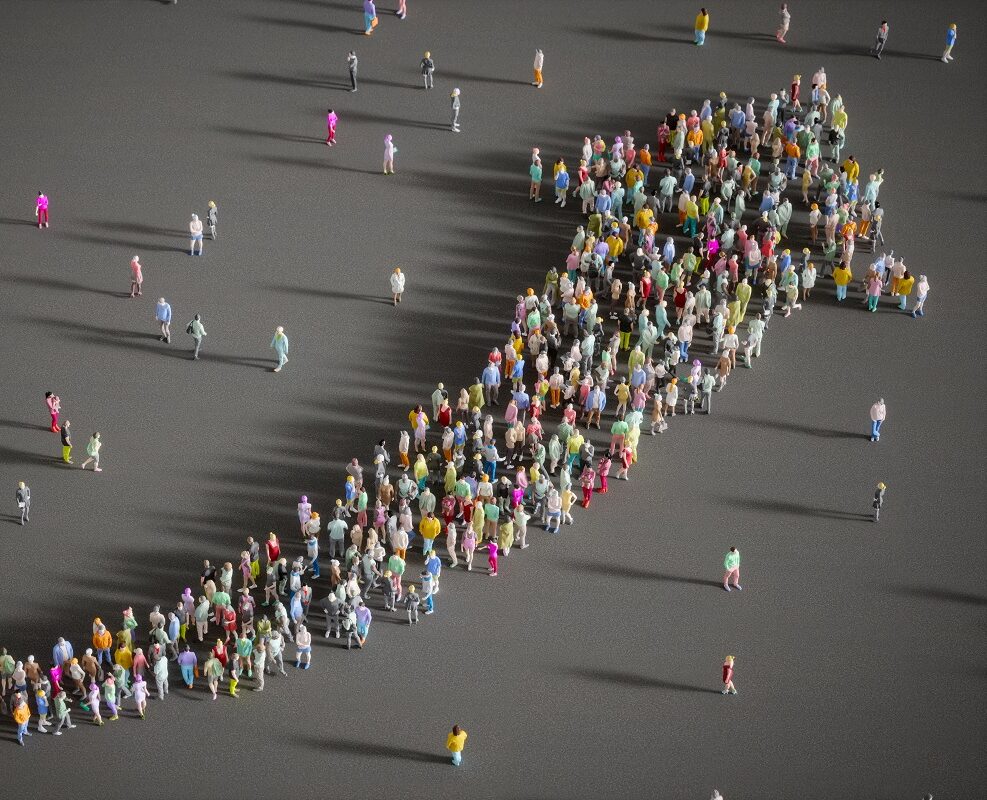 Group of people forming an arrow