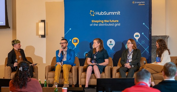 Cadmus' Michael Colby and speakers sitting in front of room at a HubSummit conference panel