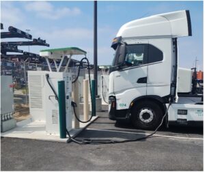 Heavy duty truck at electric charging depot