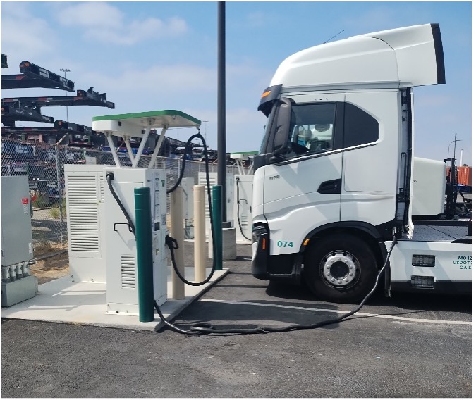 Heavy duty truck at electric charging depot