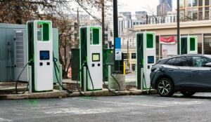 Electric car charging in a city parking lot